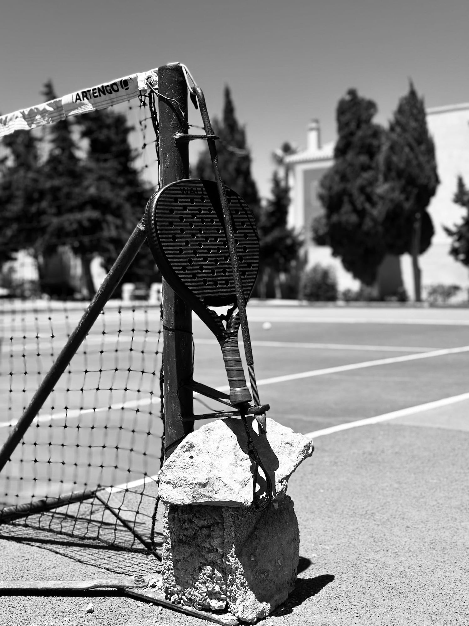 padel racket on tennis court